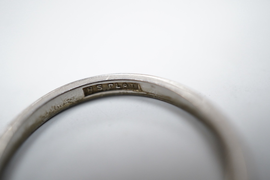An engraved platinum wedding ring, size P1/2, gross weight approximately 3 grams, Condition: some wear to engraving